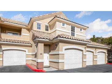 Inviting condo featuring a private garage and a classic tile roof, perfect for comfortable living at 5855 Valley Dr # 1070, North Las Vegas, NV 89031