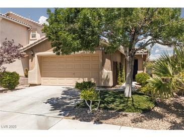 Charming single-story home with a two-car garage and mature landscaping in a residential neighborhood at 820 Bernini St, Las Vegas, NV 89144