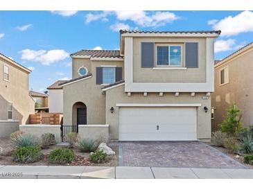 Charming two-story home featuring a two-car garage, desert landscaping, and elegant architectural details at 1556 Olivia Pkwy, Henderson, NV 89011