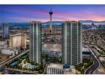Stunning aerial view of high-rise condos and the Stratosphere tower against a colorful dusk sky in Las Vegas at 322 Karen Ave # 2201, Las Vegas, NV 89109