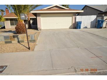 Charming single-story home with a two-car garage and desert landscaping at 4354 Thorndale Pl, Las Vegas, NV 89103