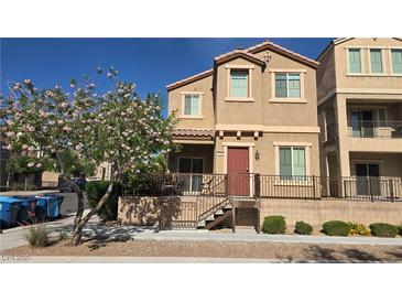 Charming two-story home with well-maintained landscaping and a cozy front porch at 7704 Classy Cashmere Ct, Las Vegas, NV 89149