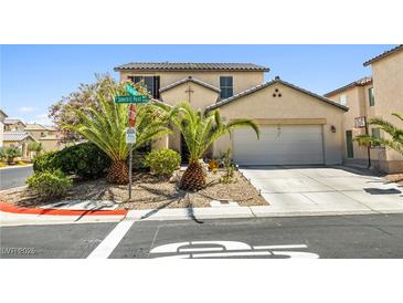 Charming two-story home with well-manicured front yard and a two-car garage at 7724 Somerhill Point Way, Las Vegas, NV 89139