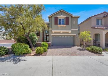 Charming two-story home with a brick driveway and a well-maintained front yard at 10845 Drake Ridge Ave, Las Vegas, NV 89166