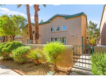Charming townhome featuring desert landscaping, a private entrance, and a tranquil setting at 5615 Calais Ct, Las Vegas, NV 89118