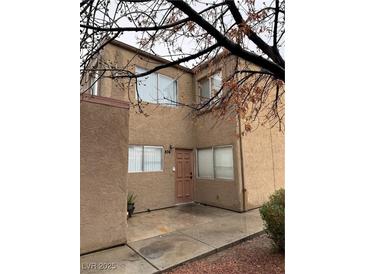 Charming two-story home with a welcoming front door and large windows allowing plenty of natural light at 574 Roxella Ln # C, Las Vegas, NV 89110