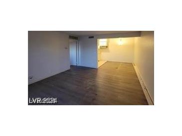 View of the open living room area that flows into the kitchen at 615 S Royal Crest Cir # 10, Las Vegas, NV 89169