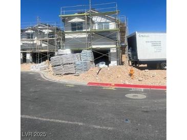 New construction home featuring scaffolding with materials delivered on-site at 8418 Sycamore Creek St, Las Vegas, NV 89113