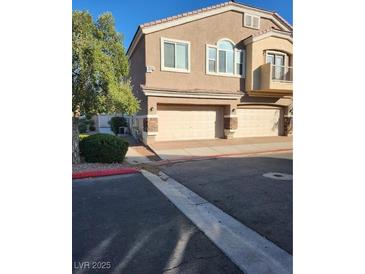 Inviting two-story home with a two-car garage and well-maintained landscaping at , Henderson, NV 89002