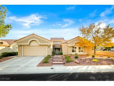 Charming single-story home with desert landscaping, tile roof, and an attached two-car garage at 10125 Hope Island Dr, Las Vegas, NV 89134