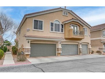 Attractive townhome featuring a private balcony and attached two-car garage at 1150 Red Margin Ct # 101, Las Vegas, NV 89183