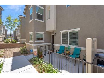 Inviting townhome with a cozy, gated front patio, perfect for enjoying outdoor living at 12348 Golden Wreath Rd # 1, Las Vegas, NV 89183