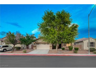 Charming single-story home featuring mature trees, a two-car garage, and well-maintained landscaping at 8128 Devils Canyon St, North Las Vegas, NV 89085