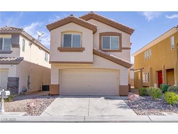 Charming two-story home with a two-car garage and well-maintained landscaping at 236 Dog Leg Dr, Las Vegas, NV 89148