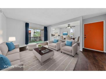 Cozy living room featuring modern furnishings and a bright, open floor plan with access to the balcony at 1405 Vegas Valley Dr # 98, Las Vegas, NV 89169