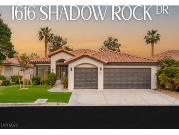 Charming single-story home featuring a tile roof, desert landscaping, and a spacious three-car garage at 1616 Shadow Rock Dr, Las Vegas, NV 89117