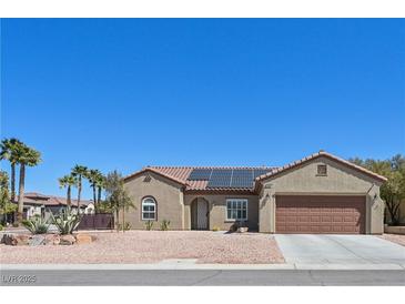 Charming single-story home with desert landscaping, solar panels, and a two-car garage at 2320 Anderson Park Dr, Henderson, NV 89044