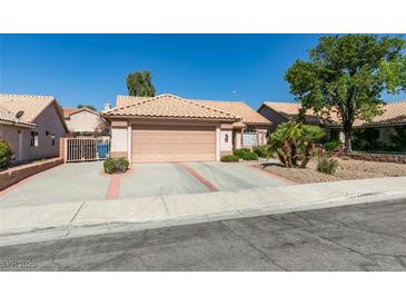 Charming single-story home featuring a well-maintained front yard and a two-car garage at 259 Baring Cross St, Henderson, NV 89074