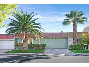 Charming single-story home featuring desert landscaping, a tile roof, and an attached two-car garage at 3753 Heritage Ave, Las Vegas, NV 89121