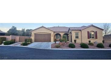 Charming single-story home with well-manicured landscaping and an attached two-car garage at 4242 Helena Hideaway Ct, Las Vegas, NV 89129