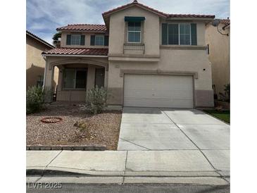 Charming two-story home with a spacious two car garage and low maintenance front yard at 8215 Shell Beach Ct, Las Vegas, NV 89117