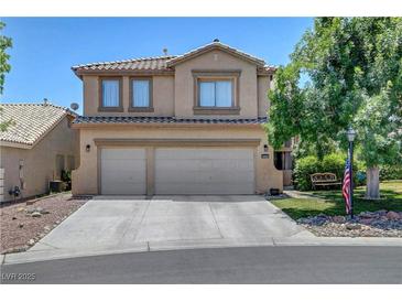 Charming two-story home featuring a three-car garage, desert landscaping, and a welcoming facade at 8333 Valley Stream Ave, Las Vegas, NV 89131