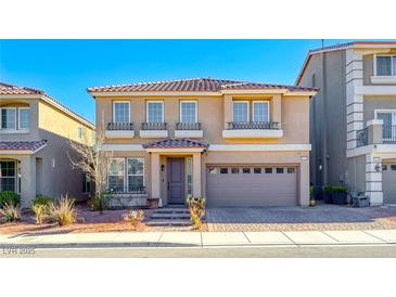 Charming two-story home featuring a tile roof, neutral stucco, and attached two-car garage at 10598 Aphrodite St, Las Vegas, NV 89183