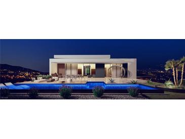 Stunning modern home featuring a sleek pool with an incredible outdoor living space and city views at 1204 Powerwall Pl, Henderson, NV 89012