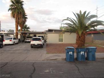Single story home has a covered carport and low maintenance rock landscaping at 2409 Maroney Ave, Las Vegas, NV 89104