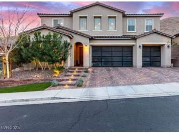 Beautiful two-story home featuring a two-car garage and professionally landscaped front yard with charming walkway lighting at 3929 Reyes Ave, Las Vegas, NV 89141