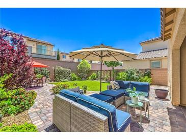 Inviting backyard features comfortable seating, lush lawn, and mature landscaping at 12286 Silvana St, Las Vegas, NV 89141