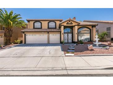 Charming two-story home featuring a three-car garage and inviting front yard with decorative fountain at 6 High Sierra Dr, Henderson, NV 89074