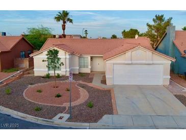 Charming one-story home with desert landscaping and attached two car garage at 8010 Coffee Tree Ct, Las Vegas, NV 89123