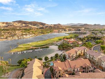 Breathtaking aerial view of lakefront homes, golf course, and mountain views in a picturesque community at 11 Via Vita Bella, Henderson, NV 89011