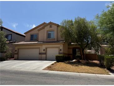 Charming two-story home with a spacious driveway, and a three-car garage at 11457 Steponia Bay St, Las Vegas, NV 89141