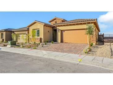 Charming single-story home with a two-car garage and landscaped front yard at 164 Cabo Cruces Dr, Henderson, NV 89011