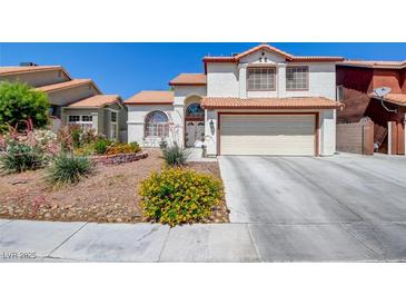Charming two-story home with a well-manicured lawn and a two-car garage, offering great curb appeal at 4615 Stearman Dr, North Las Vegas, NV 89031