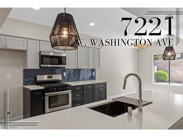 Beautiful kitchen featuring stainless steel appliances, modern countertops, and stylish light fixtures at 7221 W Washington Ave, Las Vegas, NV 89128