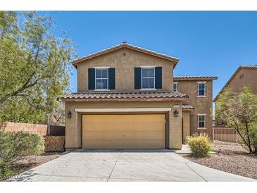 Charming two-story home with a two-car garage, dark shutters, and neutral stucco under a clear blue sky at 8252 Pearl Oasis Ct, Las Vegas, NV 89139