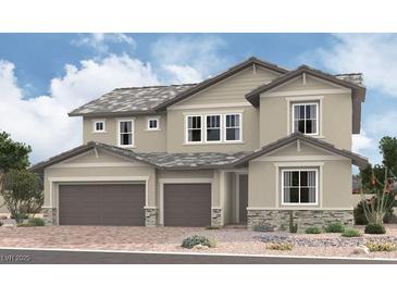 Two-story home featuring a two-car garage, neutral colored siding, and complementary stone accents at 1168 Viento View Ave, Henderson, NV 89012