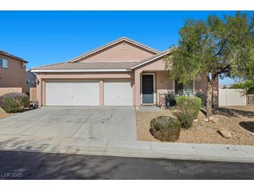 Charming single-story home with a three-car garage and xeriscaped front yard at 4308 Brazil Palm Ct, North Las Vegas, NV 89032