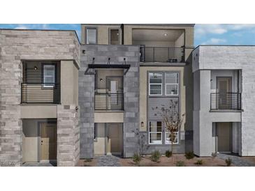 Modern three-story townhome with private balconies and stone accents at 899 Apatite Pl # Lot 61, Henderson, NV 89011