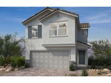 Charming two-story home featuring a two-car garage, neutral paint and simple, clean landscaping at 9246 Dekalb Ct, Las Vegas, NV 89148