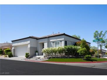 Charming corner lot home with a well-manicured lawn and attached two-car garage at 10532 Redwood Ash Ave, Las Vegas, NV 89144