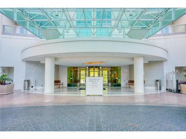 Elegant building entrance featuring valet, modern architecture, and ample seating in a refined environment at 222 Karen Ave # 2506, Las Vegas, NV 89109