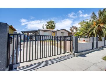View of the front of the property highlighting the gated front yard for security and privacy at 237 Cervantes St, Las Vegas, NV 89101