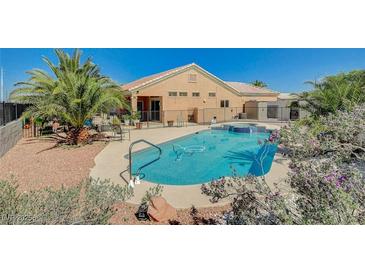 Inviting backyard pool and spa with a desert landscape and covered patio provides a relaxing outdoor space at 3112 Haddon Dr, Las Vegas, NV 89134