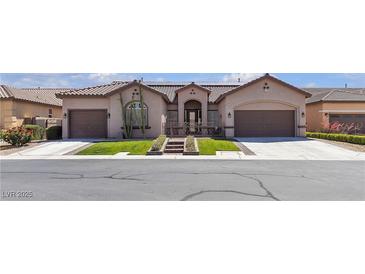 Beautiful home exterior boasts mature landscaping, tile roof, three-car garage, and desert accents at 7228 Fern Meadow St, Las Vegas, NV 89149