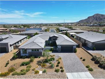 Stunning single-story home with a desert landscape and mountain views at 9475 W Rosada Way, Las Vegas, NV 89149