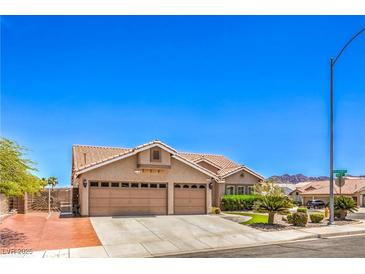 Charming single-story home featuring a three-car garage and desert landscaping at 1044 Spanish Needle St, Henderson, NV 89002